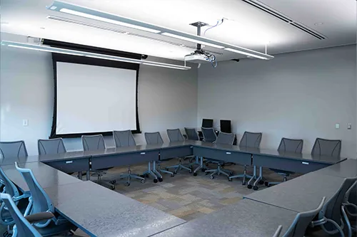 Rundell Hall Multi-Purpose Room: square seating arrangement with projector and screen
