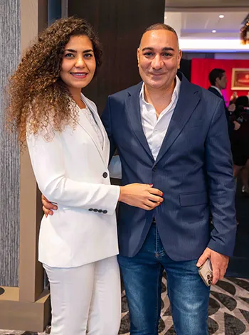 Two people pose for a photo