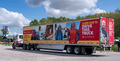 A tractor-trailer rig with Lee College branding.