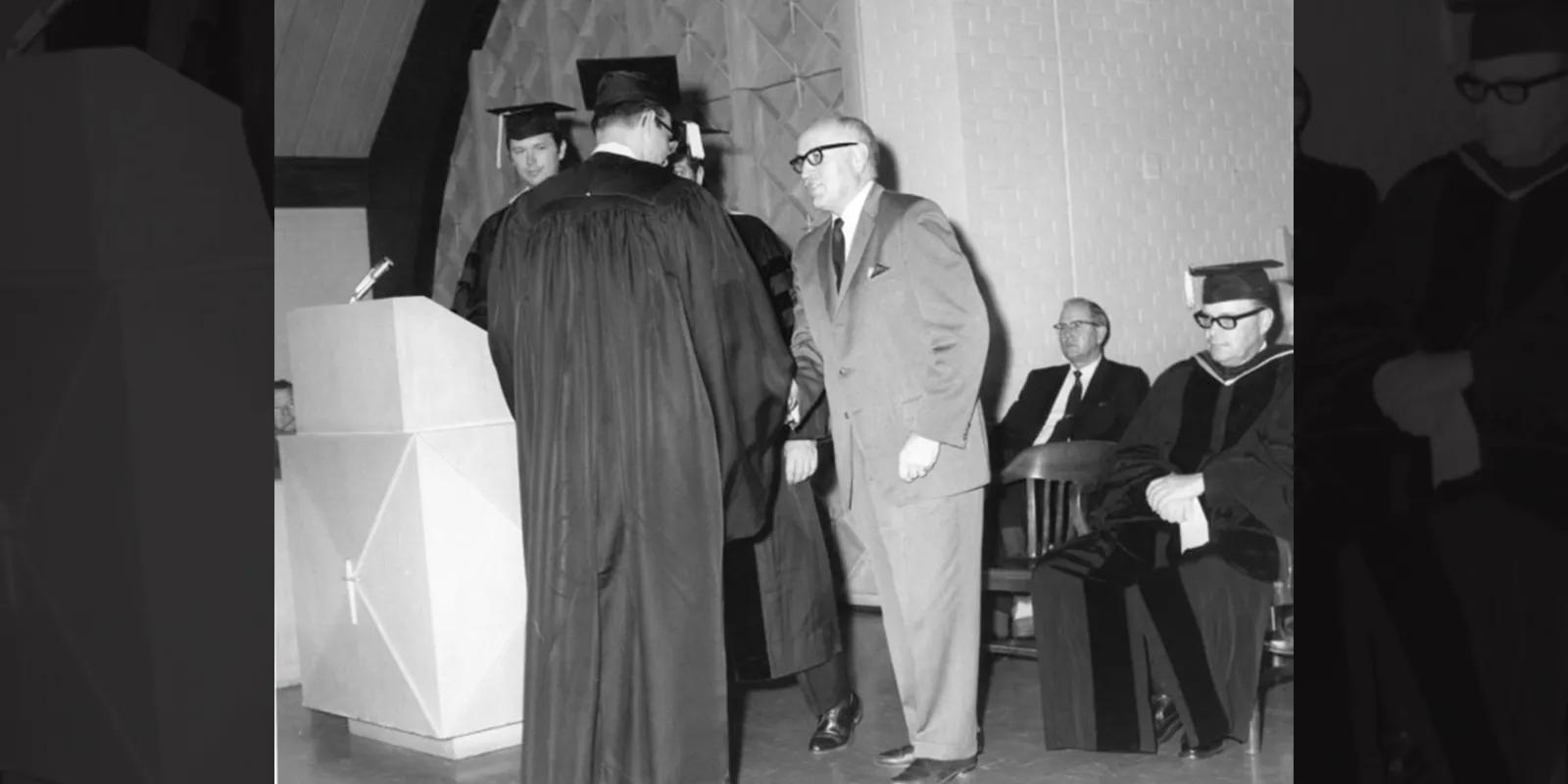 Dean Rundell shakes the hand of a Huntsville Center graduate.