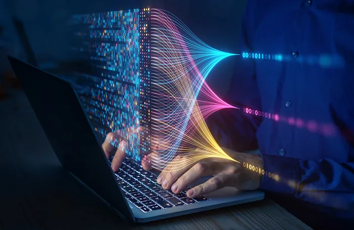 Computer Science: concept art of hands typing on a laptop, with numbers and lines hovering in the air